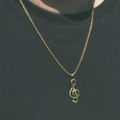 Brass Treble Clef Music Note Pendant With 18k Gold Box Chain -Stretch It Body Jewellery brass treble clef music note pendant with 18k gold box chain model shot