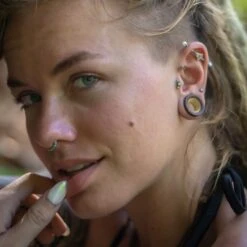 Coconut Wood Double Flare Tunnel With Crocodile Wood Inlay 10 Coconut Wood Double Flare Tunnel With Crocodile Wood Inlay -Stretch It Body Jewellery coconut wood double flare tunnel with crocodile wood inlay model shot four