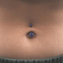 Double Tanzanite Blue Jewelled Internally Threaded Titanium Belly Bar 8 Double Tanzanite Blue Jewelled Internally Threaded Titanium Belly Bar -Stretch It Body Jewellery double tanzanite blue jewelled internally threaded titanium belly bar model shot