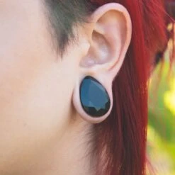 Faceted Black Glass Double Flare Teardrop Plug 9 Faceted Black Glass Double Flare Teardrop Plug -Stretch It Body Jewellery faceted black glass double flare teardrop plug model shot close up