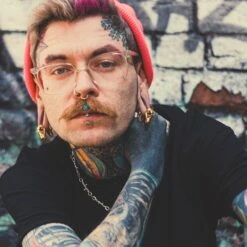 Gold PVD Dino Skull Ear Weight 10 Gold PVD Dino Skull Ear Weight -Stretch It Body Jewellery gold pvd dino skull ear weight model shot