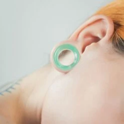 Green Cat's Eye Glass Double Flare Concave Tunnel -Stretch It Body Jewellery green cats eye glass double flare concave tunnel model shot close up f8acf2d6 f37b 429e a8fd 92f84f774090