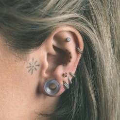 Grey Cat's Eye Glass Double Flare Concave Tunnel -Stretch It Body Jewellery grey cats eye glass double flare concave tunnel model shot