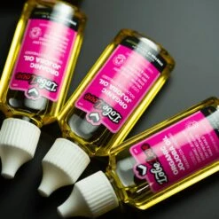 LobeLove™ Organic Golden Jojoba Oil -Stretch It Body Jewellery lobelove organic golden jojoba oil group shot two