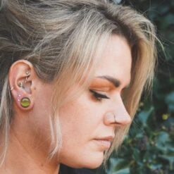 Peridot Cat's Eye Glass Single Flare Convex Plug -Stretch It Body Jewellery peridot single flare cats eye plug model shot