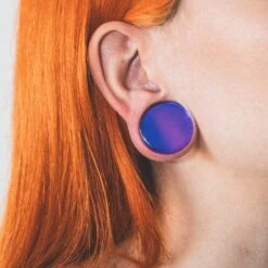 Purple Aurora Glass Double Flare Plug 10 Purple Aurora Glass Double Flare Plug -Stretch It Body Jewellery purple aurora glass double flare plug model shot close up two