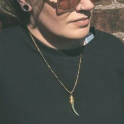 Saber Tooth Brass Pendant With 18k Gold Box Chain -Stretch It Body Jewellery saber tooth brass pendant with 18k gold box chain model shot