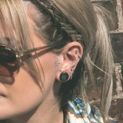 Sono Wood Double Flare Plug With Black MOP Inlay -Stretch It Body Jewellery sono wood double flare plug with black mop inlay model shot