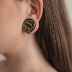 Sono Wood Double Flare Plug With Brass Honeycomb Inlay -Stretch It Body Jewellery sono wood double flare plug with brass honeycomb inlay model shot close up