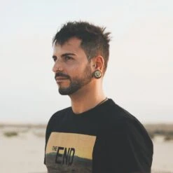 Sono Wood Double Flare Plug With Brass Owl Inlay -Stretch It Body Jewellery sono wood double flare plug with brass owl inlay model shot two