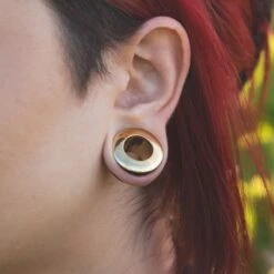 Sono Wood Double Flare Tunnel With Brass Insert 8 Sono Wood Double Flare Tunnel With Brass Insert -Stretch It Body Jewellery sono wood double flare tunnel with brass insert model shot close up