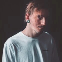 Sono Wood Double Flare Tunnel With Crushed Turquoise Halo Inlay -Stretch It Body Jewellery sono wood double flare tunnel with crushed turquoise halo inlay model shot close up