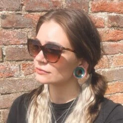 Teal Cat's Eye Glass Double Flare Concave Tunnel -Stretch It Body Jewellery teal cats eye glass double flare concave tunnel model shot chloe 1