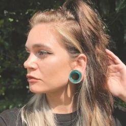 Teal Cat's Eye Glass Double Flare Concave Tunnel -Stretch It Body Jewellery teal cats eye glass double flare concave tunnel model shot chloe 4