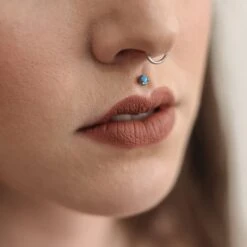 Three Prong Synth Blue Opal & Titanium Threadless Top 9 Three Prong Synth Blue Opal & Titanium Threadless Top -Stretch It Body Jewellery three prong synth blue opal titanium threadless top model shot close up