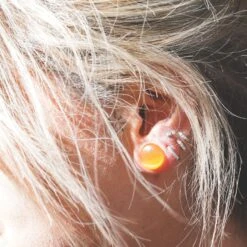 Yellow Cat's Eye Glass Single Flare Convex Plug -Stretch It Body Jewellery yellow cats eye single flare plug model shot close up